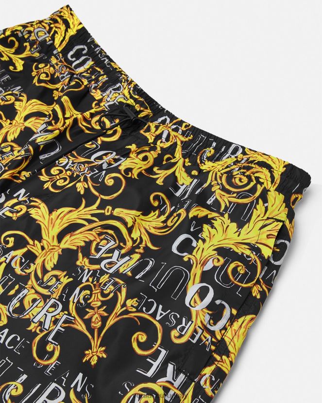 Versace pantalones de alta costura con logo hombres oro negro ropa H88R0H2430