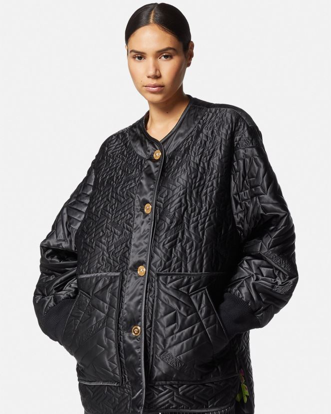 Versace chaqueta reversible con orquídeas medusa mujer negro y estampado ropa H88R0H99