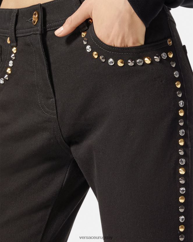 Versace jeans ajustados con tachuelas de Medusa mujer negro ropa H88R0H214