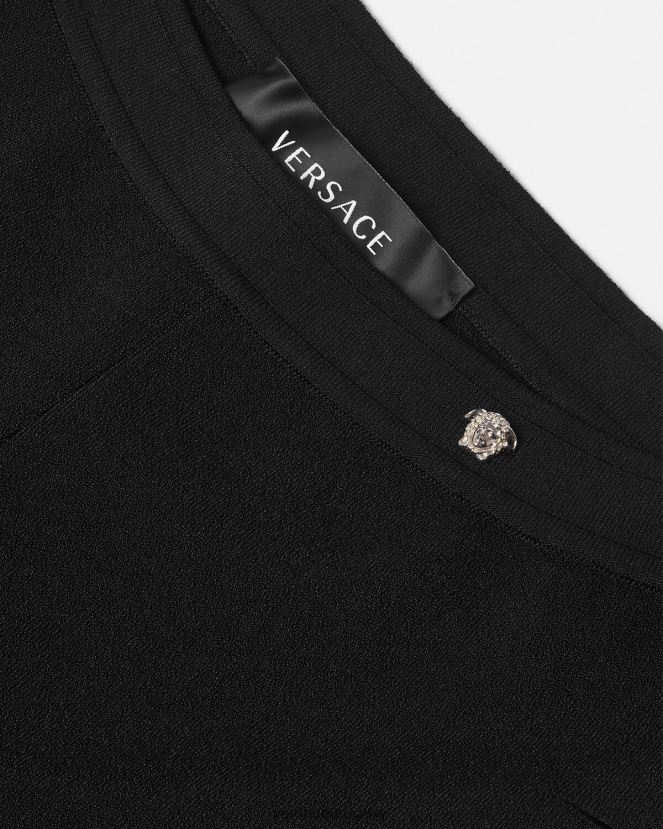 Versace pantalones acampanados de punto con cortes mujer negro ropa H88R0H208